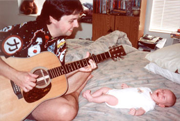 Justin loves it when Daddy plays guitar