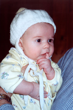 with Mom's baby hat